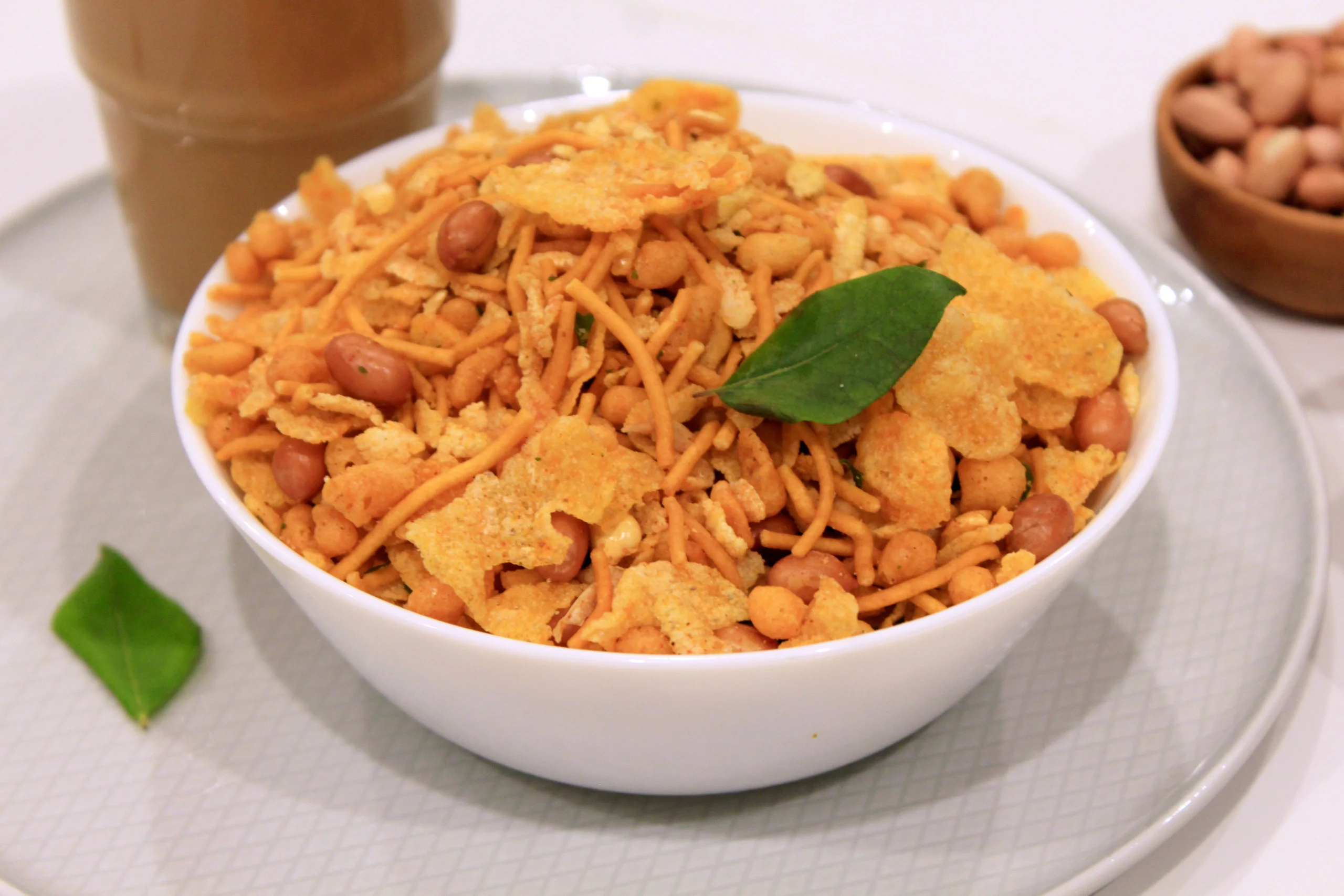 A crispy bowl of Chivda, a popular Indian snack mix with puffed rice, nuts, and spices, ideal for tea-time snacks and light bites in Ireland.