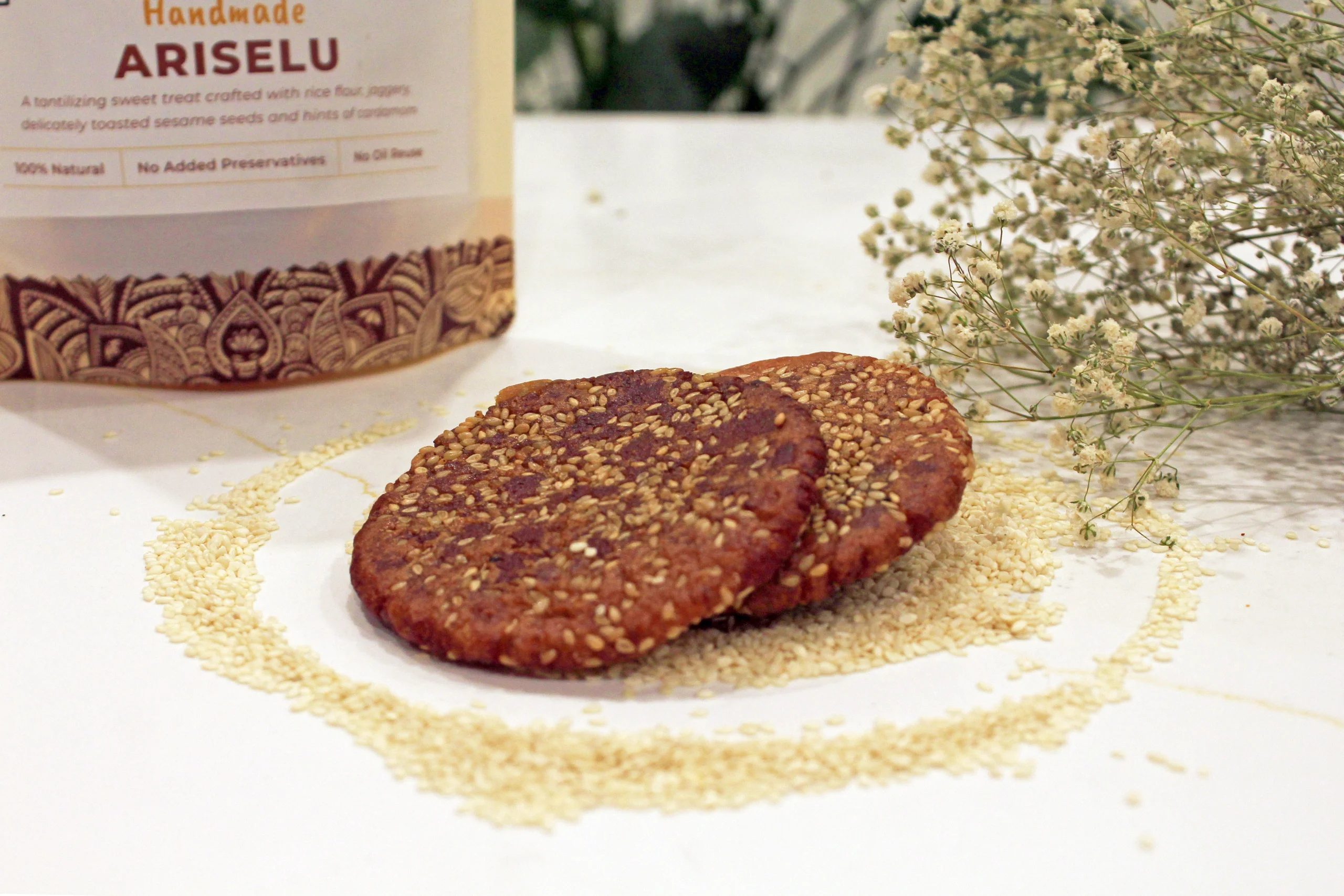 A close-up of Ariselu, showcasing its golden-brown, round shape with a slightly shiny surface, highlighting the rich texture and traditional appeal of this Indian sweet.