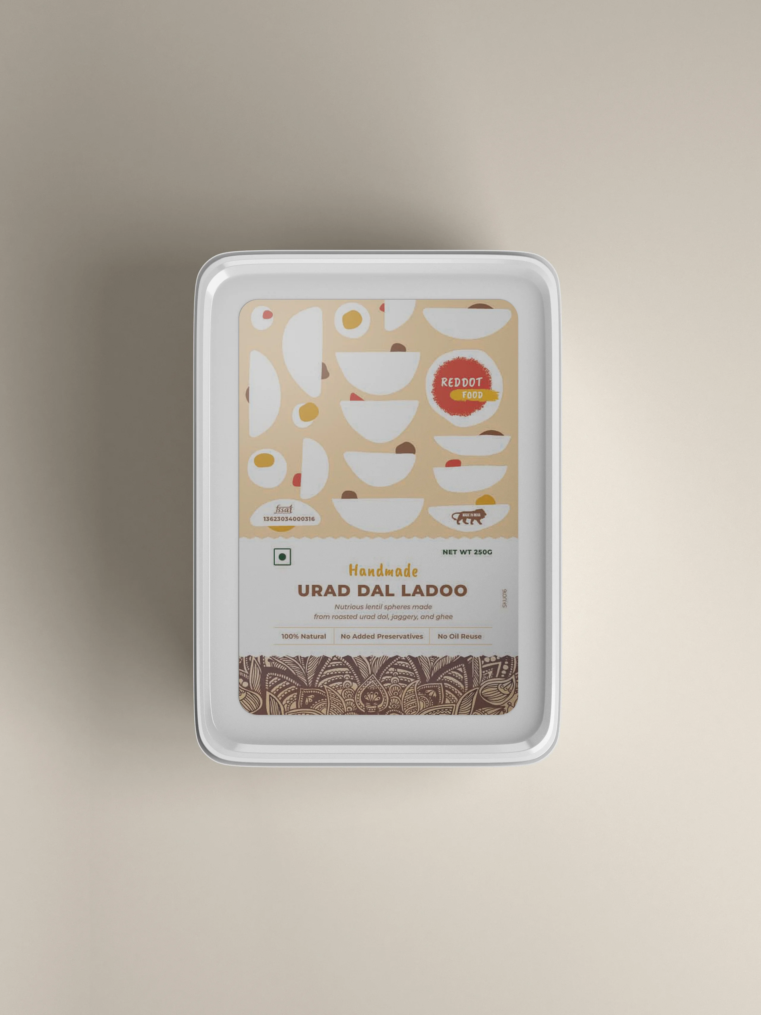 A packet of Urad Dal Ladoo by Reddot Food, featuring its packaging with branding and description, emphasizing the traditional and high-quality nature of the sweet.