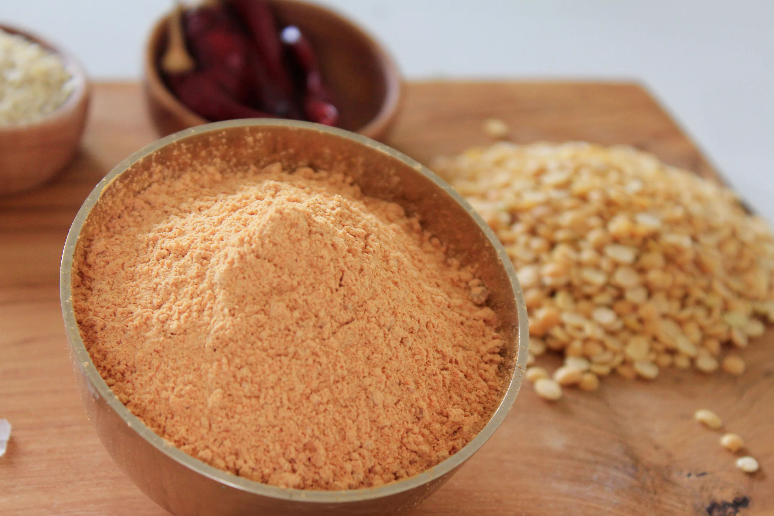 A close-up of Split Pea Podi, a traditional Indian spice blend by Reddot Food, featuring a vibrant mix of roasted split peas and aromatic spices.