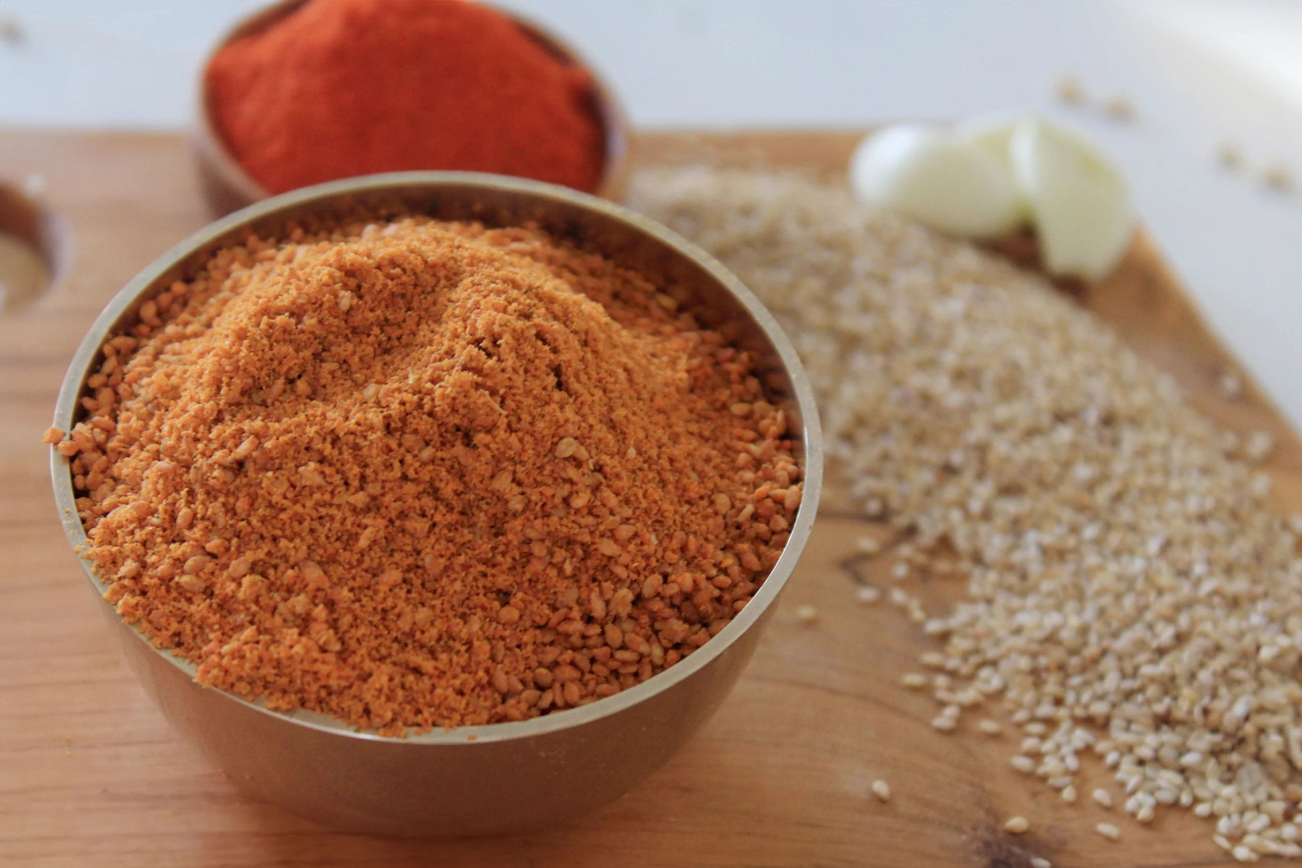 A close-up of Sesame Podi, a nutty and aromatic spice blend by Reddot Food, made with roasted sesame seeds and spices, ideal for South Indian dishes.