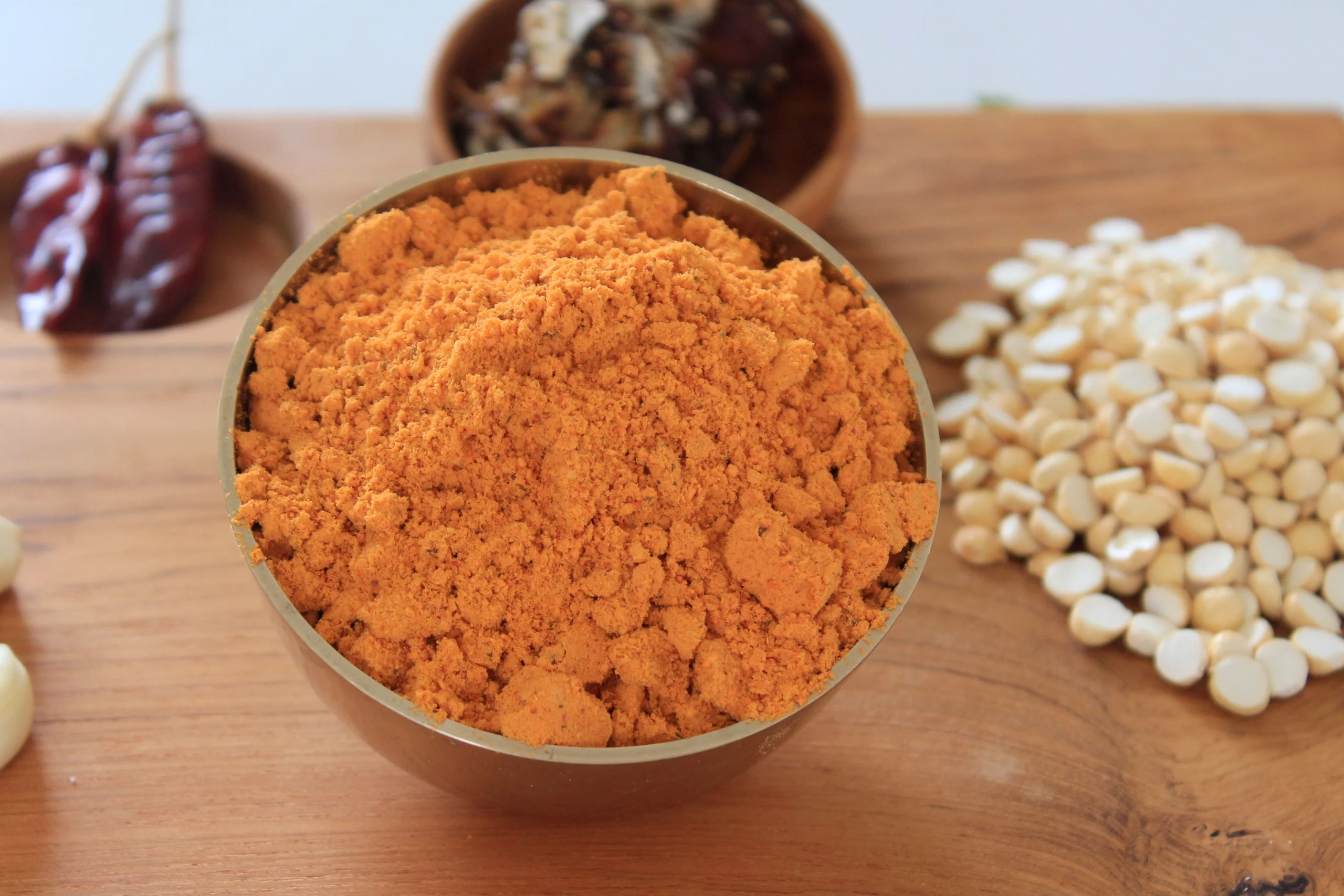 A close-up of Bengal Gram Podi, a rich and flavorful spice blend by Reddot Food, made with roasted Bengal gram and spices, ideal for enhancing South Indian dishes.