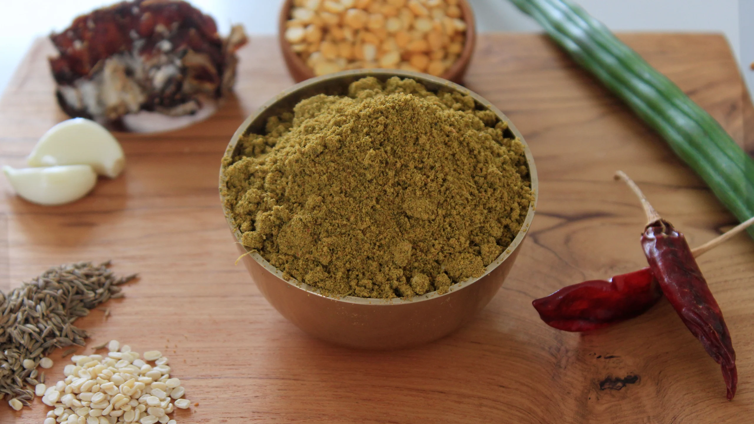 A close-up of Moringa Podi, a healthy and flavorful Indian spice blend by Reddot Food, made with nutrient-rich moringa leaves and aromatic spices, perfect for enhancing the taste of rice and other dishes.