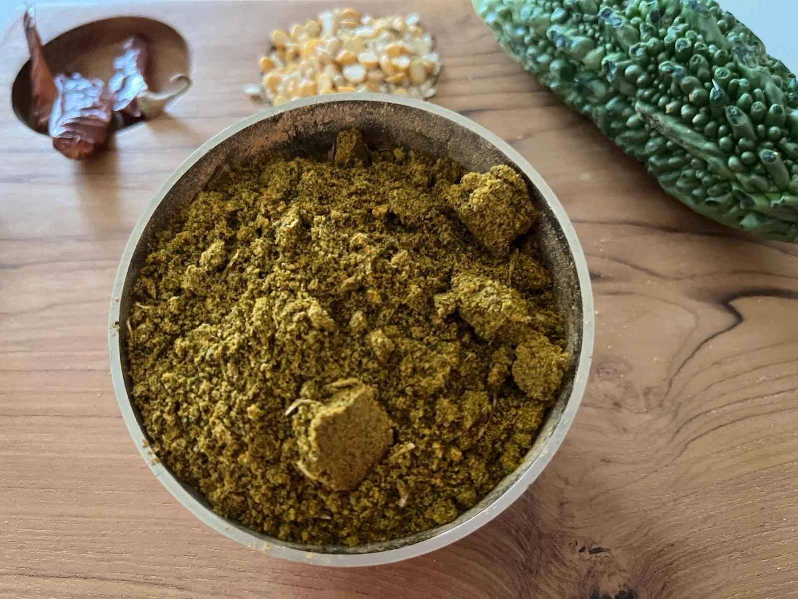 A close-up of Bitter Gourd Podi, a savory and spicy spice blend made with dried bitter gourd and assorted spices by Reddot Food, perfect for adding a unique flavor to rice and other dishes.