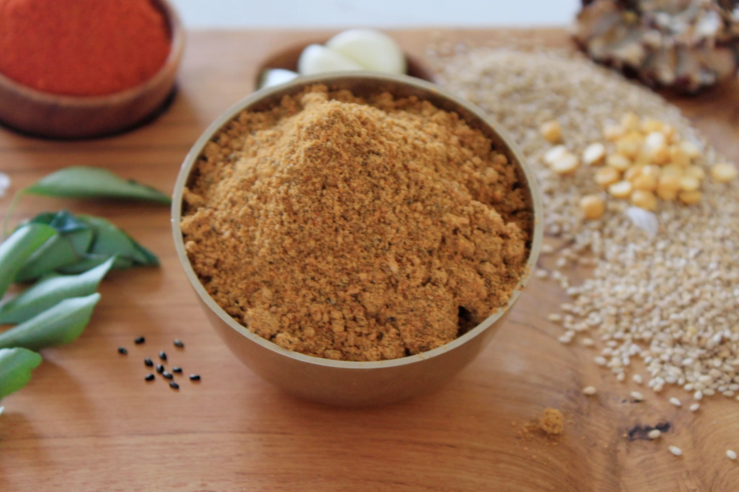 A close-up of Chia Sesame Podi, a nutritious spice blend made with chia seeds and sesame seeds by Reddot Food, perfect for adding a healthy and flavorful touch to your meals.