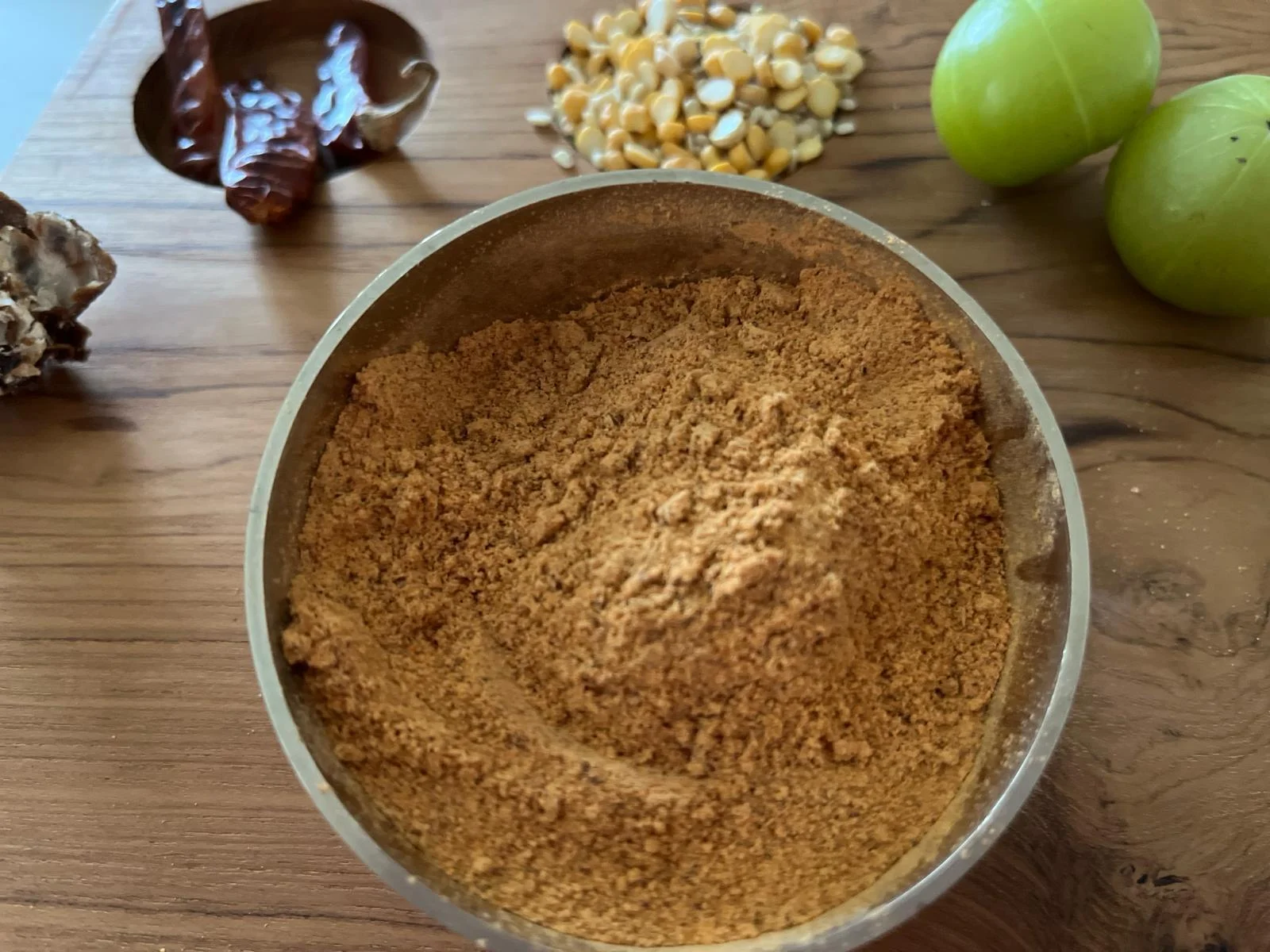 A close-up of Gooseberry Podi, a tangy and nutritious spice blend made from dried gooseberries and spices by Reddot Food, ideal for enhancing your meals with a unique flavor.