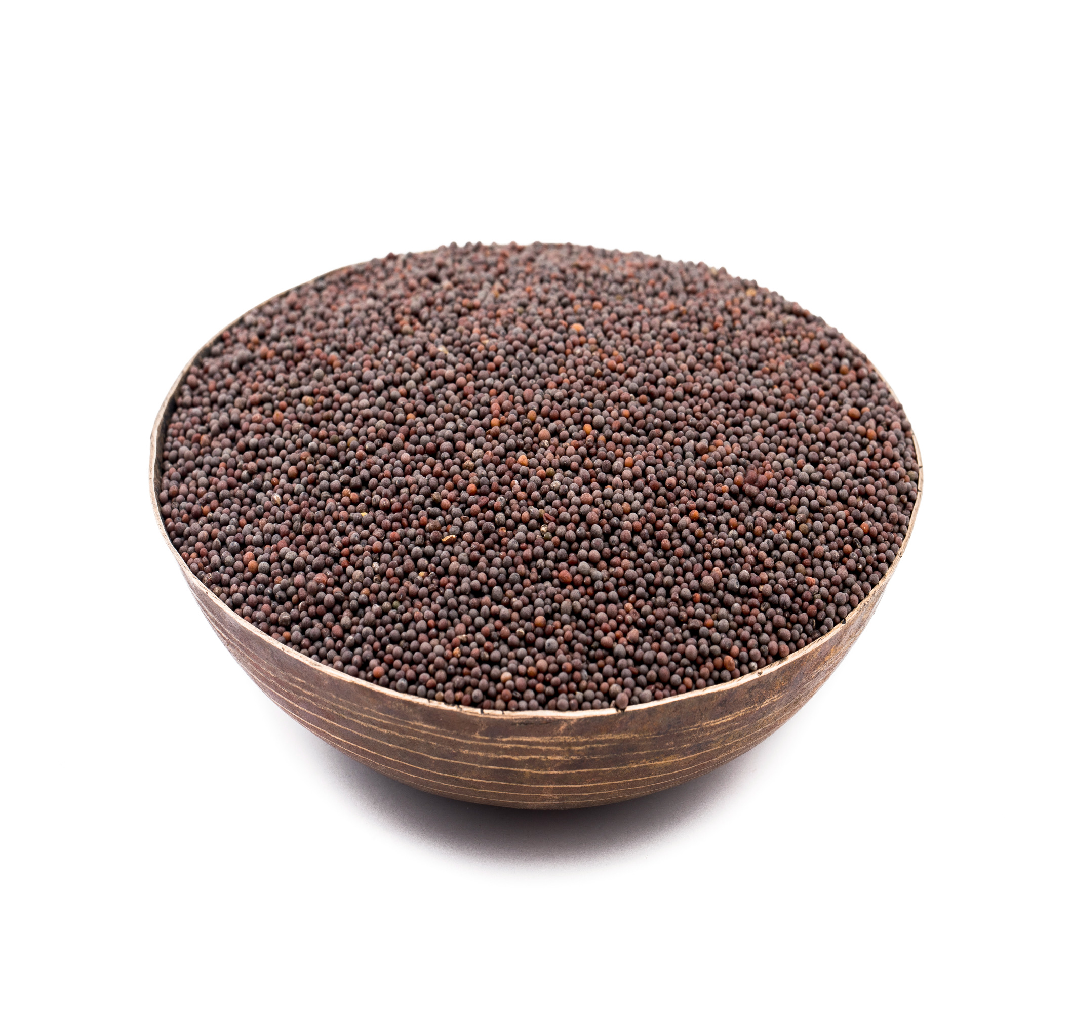 A close-up of mustard seeds, highlighting their small, round, and dark brown texture.